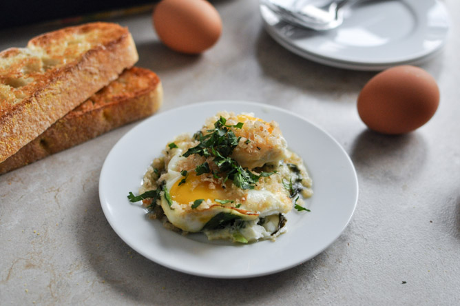 Fontina & Spinach Baked Eggs w/ Garlic Brown Butter Breadcrumbs