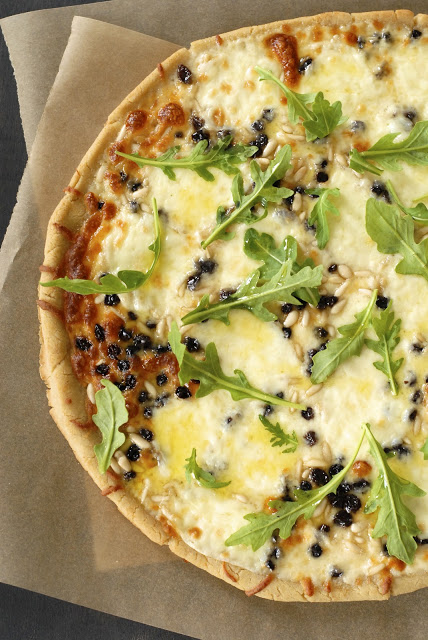 Mozzarella Pizza with Pine Nuts, Currants and Arugula
